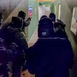 Law enforcement officers participating in ISTM advanced tactical medicine training scenario