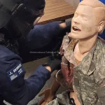Student delivering patient treatment during advanced tactical medicine course